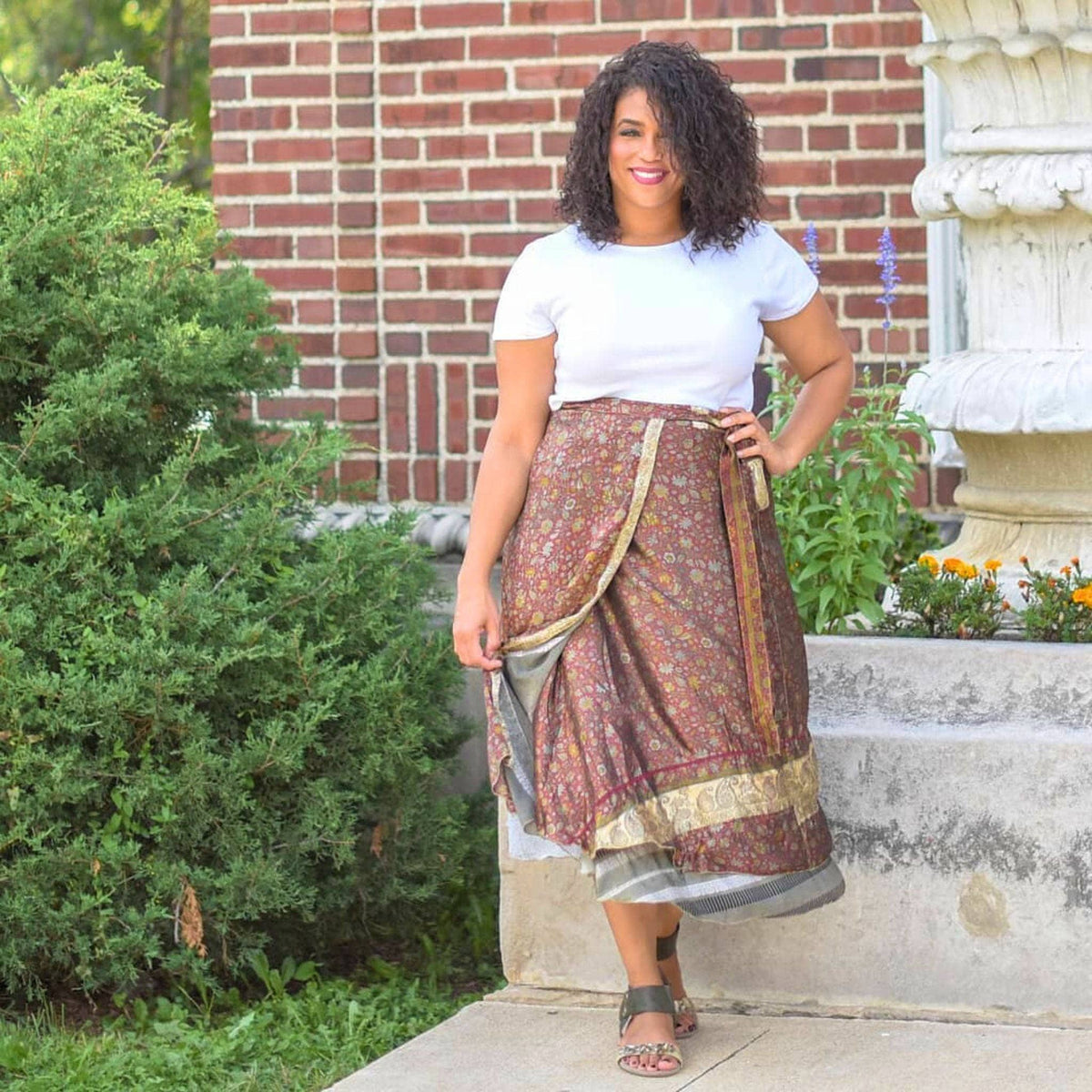 Colorful sari wrap skirt from Darn Good Yarn, showcasing vibrant fabric and traditional design, styled as a versatile clothing accessory.