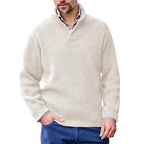 Man wearing a Mandotos International white high neck classic ribbed sweater over a collared shirt.