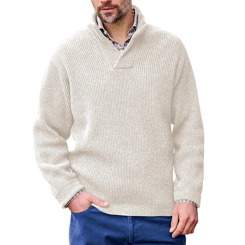 Man wearing a Mandotos International white high neck classic ribbed sweater over a collared shirt.