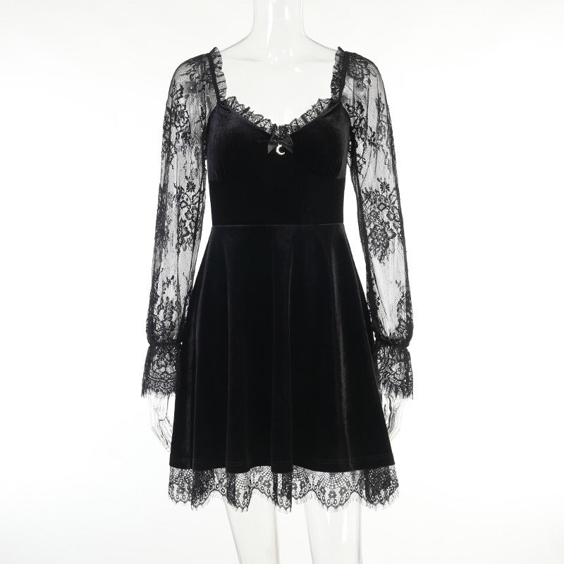 Mandotos International chic black velvet dress with lace sleeves and hem