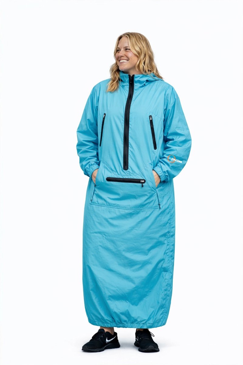 IWOM WeatherShield Convertible Jacket in black, showing its adjustable hood and multiple zipper pockets for versatile outdoor wear.