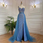 Blue handmade beaded split shoulder fishtail dress by MANDOTOS showing intricate beading and elegant fit on a model.