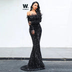 Elegant black evening dress by MANDOTOS, featuring a fitted silhouette and classic neckline, ideal for formal events.
