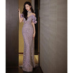 Elegant women's evening gown by MANDOTOS featuring a halter neckline and French-inspired style, perfect for formal occasions.