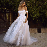 Mandotos off-the-shoulder lace wedding dress with appliques, A-line silhouette, princess style, bridal gown with elegant detailing.