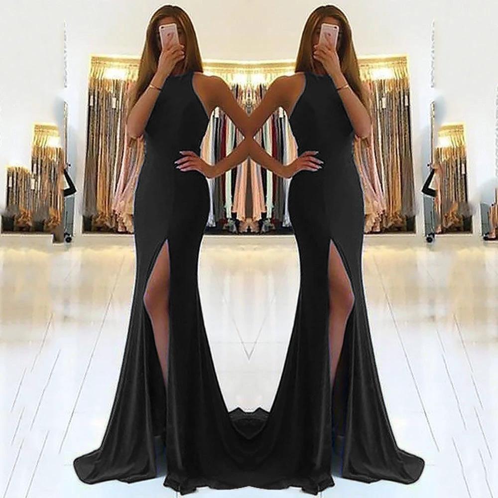 Long elegant ladies' evening dress by MANDOTOS, featuring a flowing fabric and formal design, suitable for special occasions.