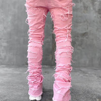 Men's Mandotos stacked jeans with patched design, long tight fit trousers showcasing bold style and detailed denim features.