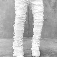 Men's stacked jeans by MANDOTOS featuring patched details and a long tight fit, ideal for bold style and modern casual wear.