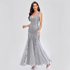 Mandotos sleeveless long mermaid dress with V-neck, embroidered sequins, and a slim fit for an elegant evening look.