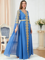 Women's spliced skirt and long sleeve dress by MANDOTOS, featuring a stylish design and flowing fabric.