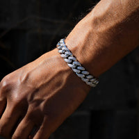 12mm white gold diamond Cuban link bracelet by Mandotos, showcasing a luxurious, polished jewelry piece with sparkling diamonds.