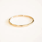 14K gold filled textured stacking ring by MANDOTOS, showcasing a close-up view of its detailed, shiny surface and design.