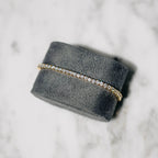 18K gold-plated zircon tennis bracelet by MANDOTOS featuring sparkling cubic zirconia stones on a delicate chain