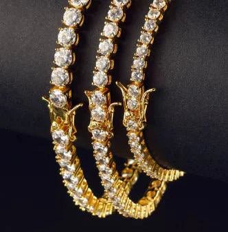 18K gold plated zircon tennis bracelet by MANDOTOS featuring sparkling cubic zirconia stones on a delicate chain.