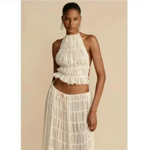 Mandotos 2-piece chic halter dress suit set featuring a stylish halter top and matching skirt in a modern design.