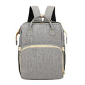 Mandotos all-in-one stroller diaper backpack with multiple compartments and adjustable straps, designed for parents on the go.