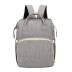 Mandotos all-in-one stroller diaper backpack with multiple compartments and adjustable straps, designed for parents on the go.