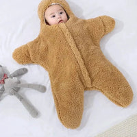 Soft baby quilt by MANDOTOS with colorful, cozy fabric featuring playful patterns and gentle stitching, perfect for infants.