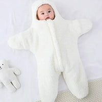 Soft baby quilt by MANDOTOS with colorful patterns, perfect for cuddling and keeping your little one cozy.