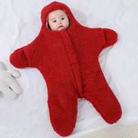 Soft baby quilt by MANDOTOS featuring colorful, cozy fabric with playful patterns for newborns and infants.