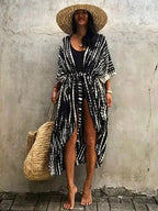 Mandotos Beach Chic Cover-Up featuring lightweight, stylish fabric perfect for sun-kissed beach outings and relaxed summer adventures.