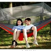 Mandotos bug-free camp hammock for outdoor relaxation, featuring mosquito protection for two people in a natural setting.