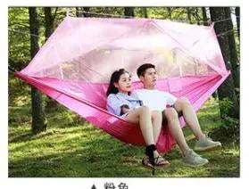 Mandotos bug-free camp hammock for two with mosquito protection, set up outdoors for relaxing relaxation in nature.