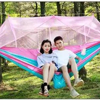 Mandotos Bug-Free Camp Hammock for two with mosquito protection, outdoor relaxation, and durable fabric.