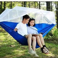 Mandotos bug-free camp hammock for two, featuring mosquito protection, ideal for outdoor relaxation and serene camping experiences.