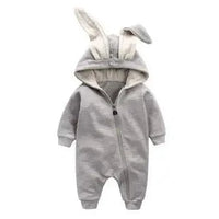 Pink bunny ear baby onesie by MANDOTOS with soft fabric, featuring adorable bunny ear hood and cute animal print.