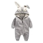 Pink bunny ear baby onesie by MANDOTOS, soft fabric with adorable bunny ear hood, perfect for cute and cozy baby outfits.