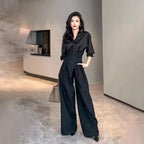 Mandotos chic flowy wide-leg trousers, lightweight fabric, high waist, and relaxed fit, perfect for stylish casual wear.