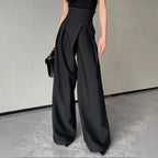Mandotos chic flowy wide-leg trousers shown in a relaxed fit with smooth fabric and a stylish, modern silhouette.