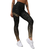 Mandotos chic gold print leggings featuring a stylish gold pattern on black stretchy fabric, perfect for casual or athletic wear.