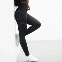 Mandotos Chic Gold Print Leggings featuring stylish gold pattern on comfortable black fabric.