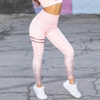 Mandotos chic gold print leggings featuring stylish gold pattern on black stretchy fabric for a fashionable look.