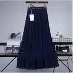 Mandotos Chic & Grace pleated chiffon skirt with flowing fabric, perfect for elegant, effortless style in a stylish fashion image.
