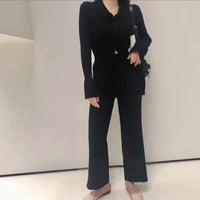 Mandotos Chic Knit Collared Ensemble featuring a cozy knit top with a collared neckline and matching pants, stylish and comfortable.