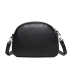 Mandotos chic leather circle purse with a sleek design and zipper closure, perfect for stylish everyday use.