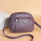 Mandotos chic leather circle purse with sleek design and top handle, perfect for stylish everyday use.