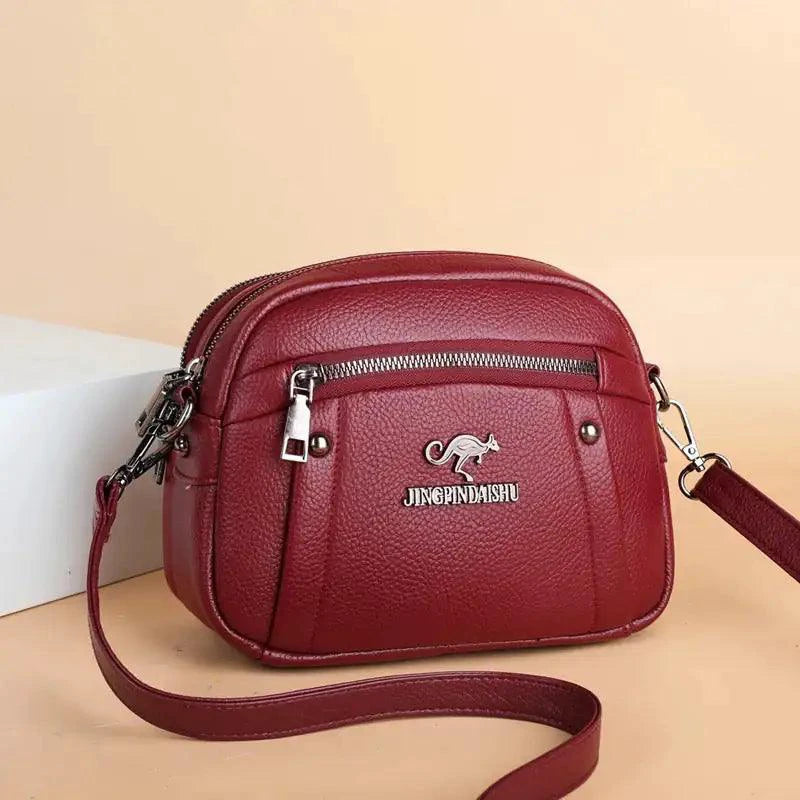 Mandotos chic leather circle purse with a sleek design and adjustable strap, perfect for stylish everyday use.