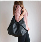 Mandotos chic leather tote handbag with sturdy handles and sleek design, perfect for everyday use and stylish occasions.