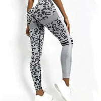 Mandotos chic leopard print high-rise yoga tights laid flat, showcasing stretchy fabric and stylish design for activewear.
