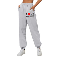 Mandotos chic love print trousers featuring stylish pattern and tailored fit, perfect for fashionable casual wear.