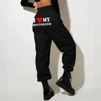 Mandotos chic love print trousers with stylish design, featuring a comfortable fit and vibrant pattern for casual or trendy wear.