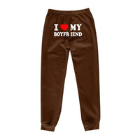 Mandotos chic love print trousers featuring stylish design, tailored fit, and vibrant pattern for a fashionable look.