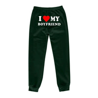 Mandotos Chic Love Print Trousers featuring stylish heart patterns, slim fit, and comfortable fabric for casual and trendy wear.
