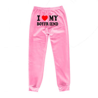Mandotos Chic Love Print Trousers featuring a stylish heart pattern and relaxed fit, perfect for casual or trendy outfits.