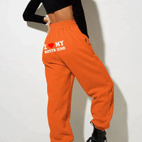 Mandotos chic love print trousers featuring a stylish pattern and comfortable fit, perfect for casual or trendy outfits.