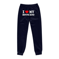 Mandotos Chic Love Print Trousers featuring a stylish heart pattern and tailored fit, perfect for casual or trendy outfits.